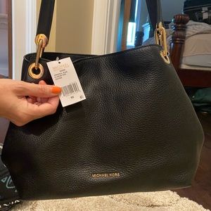 Black leather Michael Kors bag. 11L X 14H